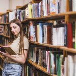 back-school-concept-with-woman-studying-library